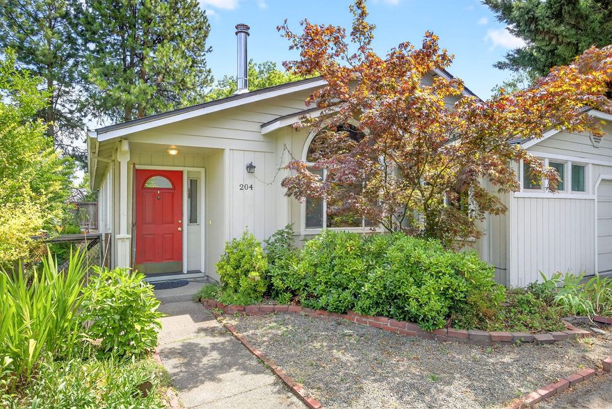 Seeking peace and quiet, yet close to downtown? Search no further than this single level, 4 bedroom, 2 bath home located on a quiet lane off Patterson St. with only two other homes. Comfortable and open with vaulted ceilings, hardwood floors, granite countertops and newer appliances. A window seat and pellet stove in the living room are perfect for cozy winter days and newer HVAC to keep you cool in summer. The 4th bedroom is currently being used as an art studio, but could also be a yoga studio, meditation room or office. The primary       en suite bedroom has French doors that lead to the covered back porch where you can enjoy morning coffee in the shade. A nice sized and manageable backyard with mature perennials is waiting for your special touch! The roof is approximately 8 years old, HVAC is approx. 5 years old and the water heater was new in 2024. Water softener added in 2023.