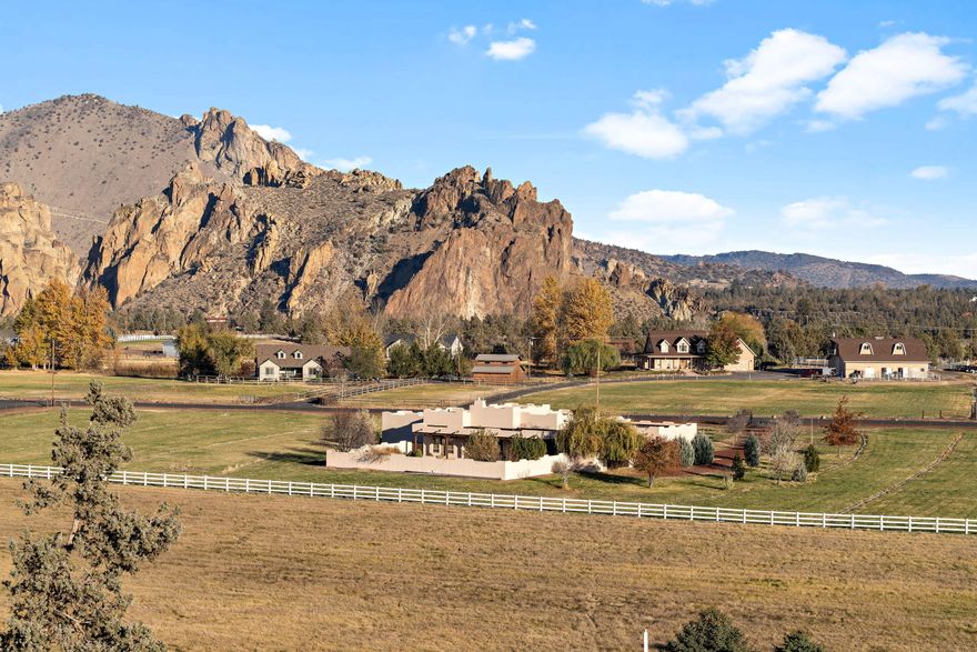 Suburban Paradise! Sunsets glistening off Smith Rocks frame the backdrop for this elegantly designed Spanish Style Stucco Home on 5.18 acres w/irrigation & Casita. Rich in detail including grand foyer w/wood pillars leading to great room w/stately wood beamed ceilings, sculpted gas fireplace, arched entry's & niches. Southwestern Flair throughout this 4 bedroom, 4 bath, 3054 Sq Ft home built in 2003. Two master suites, each offering privacy, office, plus Casita w/private entry off sunny patio. Large kitchen, tiled counters & flooring, eating bar, pantry, spacious dining room w/access to covered patio. Fenced & gated property, 4.05 acres solid set, irrigated pastures. Private well. Nicely landscaped & fenced yard w/underground sprinkler system. Triple car garage & detached shop/garage. The answer to your Dreams!