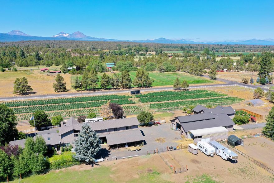 Panoramic Cascade Mountain views from Broken Top to Jefferson. Main home features two-story living room w/rock fireplace, great room with vaulted ceilings, family/bonus room, media room w/ wet bar, large master suite w/soaking tub, 4 bedrooms, 3 baths. Kitchen has granite countertops, SS appliances, refinished cabinets & hardwood floors. Attached 3-car garage plus 41x48 heated RV garage/shop w/220v & 50a & RV dump. There is also a detached 1428 sqft 2 bedroom, 1 bath/laundry room guest house with gas fireplace, great room & dedicated septic. Acreage is fenced w/ paved driveway, 3 ac. irrigation and pond. The location of this property and its proximity to Tumalo Reservoir make it ideal for horseback riding, Mt Biking, hiking, bird watching, and many other outdoor recreational activities.