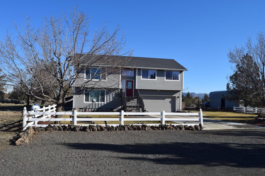 Cascade mountain views galore.  Large CRR acreage with semi-split level designed 4 bedroom/3 bath home.  Immaculate condition throughout with open kitchen/dining area, heated kitchen tile flooring\; even a built in Murphy Bed in family room. Also a Mini-split ductless A/C heating/cooling system and separate zoned Cadet heaters.  Outside a 12 x 24 composite upper deck for amazing views of the Cascades and Smith Rock.  A 1,400 sq. ft. enclosed & paved patio with built in BBQ and a gas fire pit, an attached garage, fully enclosed RV storage unit, multiple out buildings and a 1,152 sq. ft. garage-shop building, a 24'x40' 4-car parking structure and a separate 12'x12' storage building. Emergency generator switch gear in garage and well house.
Nature lovers will be attracted to the privacy and comfort of a secluded back yard patio area. Close to front of ''The Ranch'' and just a block from paved Chinook Drive. Come see one of the best cared for homes in Crooked River Ranch.