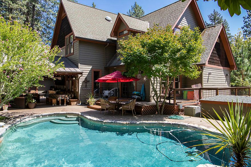 Looking for a home that checks all of the boxes? Here it is! Located at the North end of town, close to restaurants, schools and shopping yet tucked away on five secluded acres. Home offers 4089 square feet with four bedrooms, four full baths, large office space with plenty of built in storage/desk, Art studio with designated access from outside, large laundry room with extra storage on main level and additional stacked laundry on second level. Kitchen was designed and up dated in 2010 with beautiful granite counter tops, tile back splash, farm sink made of Nickel, Walnut stained custom cabinets, six burner gas cook top,double ovens with standard and convection cooking, pantry, beautiful oak flooring with rich walnut stain. Daylight basement offers a large family room, kitchenette, bedroom and full bath. Has easy access from outside yard. Separate shop with two over sized shop doors. Full RV hookups.  In ground pool, spa, outdoor covered patio. District 7 schools, county taxes.