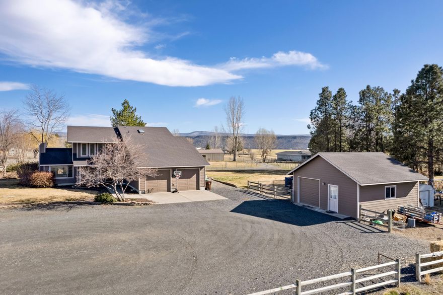 Custom-built home nestled in the rolling hills of the highly sought after Sunrise Acres neighborhood. Fully fenced 2.7 irrigated acres with room for all your toys or a perfect hobby farm.
The home features a beautiful vaulted tongue and groove ceiling in the living room along with a pellet stove. Separate dining area off kitchen, built-in oak desk and an abundance of natural light throughout the entire house. 
All three bedrooms are upstairs and the primary bedroom boasts an oversized walk-in closet. 
Two large decks provide plenty of room for entertaining and enjoying the views. Additional 24x24 fenced off area next to the detached shop/garage that is also 24x24.
Beautifully landscaped, fully fenced, private well and a new 3 hp irrigation pump this home is country living at its best!