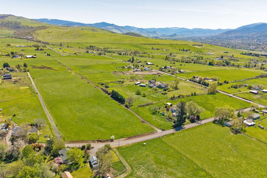 Gorgeous 7.56 acre EFU parcel with irrigation rights, homesite approval, and territorial views. Owned by the same family for generations, this parcel has gentle topography set within a serene rural setting, and is located just 10 minutes from downtown Ashland. Currently in pasture with cattle grazing, the property lines are established, utility and private road easements defined, and private road maintenance agreement drafted. There is currently no utility infrastructure, well or septic on the subject property. This parcel offers an amazing opportunity to develop a beautiful rural residence. Additionally, the adjacent 5.11 acre parcel (tax lot 700) is available separately. Combining both lots would create an ideal extended family retreat with diverse agricultural possibilities, including livestock, horses, orchards, or pasture. Buyer to perform own due diligence with regard to possible uses and/ or restrictions.