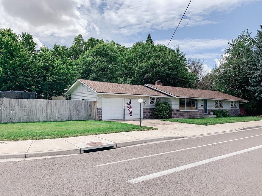 Built in 1956, this solid home has 1688 sq. ft. and offers 3 bedrooms, 2 baths, plus den/ office.  The large living room features original hardwood floors, wood burning fireplace with custom fireplace doors and picture window that takes advantage of the views of the beautiful park across the street and the surrounding mountains. The kitchen has a breakfast nook, includes newer appliances, plus a wood burning brick indoor BBQ/pizza oven.  The bedrooms have original hardwood floors and the extra large master includes an oversized walk-in closet.  Other features include laundry room with abundant storage, finished / insulated garage, new exterior paint 2019, updated bathroom in 2019 / 20, new french doors installed leading out to the covered back patio.  Newer roof and hot water heater, heat pump, fence and room to add RV parking.  Located near schools, golf course, tennis courts and children's water park.