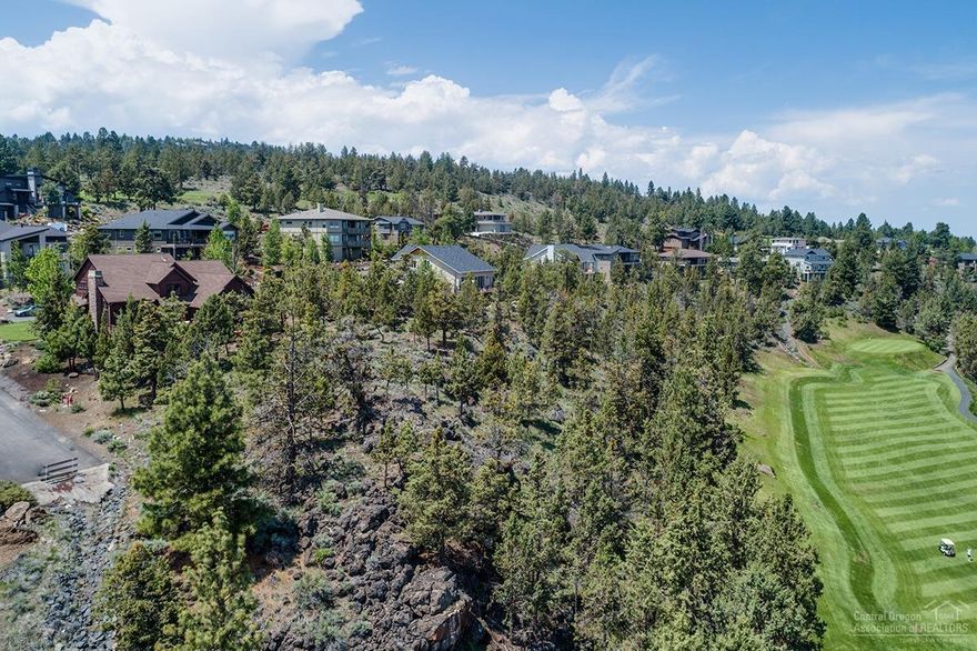 Phenomenal view lot in River's Edge Village! Nearly 1/2 acre with a dramatic ridgetop setting with golf, Smith Rock, Pilot Butte, and easterly views. Bring your builder and turn your creative vision into reality. This is your chance to own what many consider to be the finest lot in the entire neighborhood! The exceptional cul-de-sac location puts golf, river trail access, & the best of Bend's Westside at your doorstep! Elevate your life & reward yourself with a new standard of living!