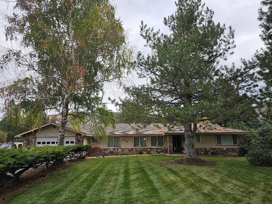 This is a GREAT 3 bedroom 3 bath home in Pinegrove on an acre with lots to offer! Notice all of the gorgeous mature trees, great for shade and privacy. There is plenty of room for all of your toys/vehicles with 3 garages, lots of parking and an RV hook up/dump. There is also a cool area in the back that is fenced that would make a great spot for a garden or maybe 4-H animals if permitted, along with a great dog kennel and dog run.  Fantastic floor plan with big open kitchen that was freshly updated with really pretty bright solid surface counters and nice big mudroom with a huge pantry. . Make sure you don't miss the newly updated primary suite bathroom also! This home has tons of elbow room, especially with the bonus/game room off of the garage. This one has it all!