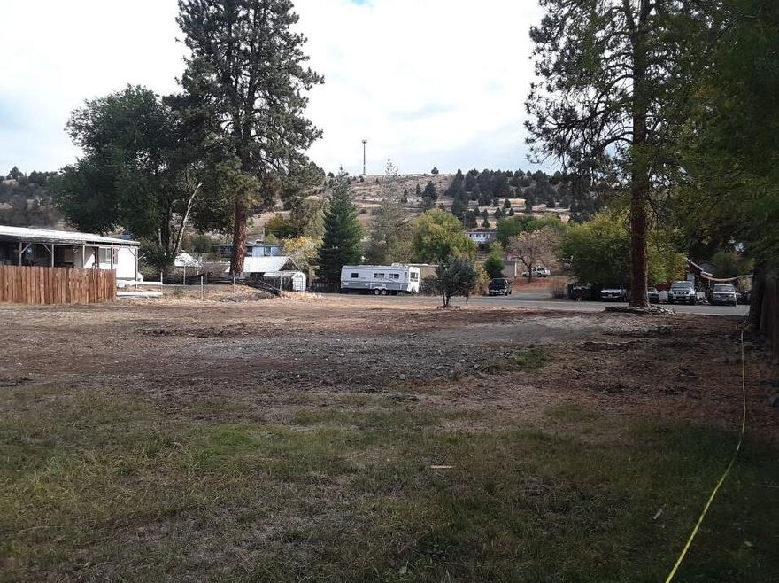 Rare opportunity in charming Prairie City, OR! These hard-to-find R2-zoned lots total 0.28 acres and are perfectly flat—ready for your new home. Just a short walk to local shops, cafes, parks, the post office, and more. The property previously had a manufactured home, so water and sewer are already connected. Electricity is available at the street. A beautiful tree remains on-site, offering potential timber value. Enjoy small-town living in a prime location with everything Prairie City has to offer and just a few miles from John Day, OR as well!