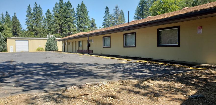 Two for One price!! Great opportunity to bring in a new business or move your current business, to this location, where 2 separate parcels have 2 separate structures, sitting on a total of 2.16 acres. One is 8620 Sq. ft block building and one is steel built warehouse that is 16,100 sq.. The 8620 building  was uses as a e-commerce center and a wholesale bus. bldg. Zoning allows many outright uses  & conditional uses. Main bldg. deemed ADA compliance & has wheel-chair access & womens & mens bathrooms. Lg. open rooms, some office(2)., kitchen/lunch room. Potential for 1/2 story upstairs to be living quarters.(studio). The warehouse metal bldg, used as storage for inventory of owners previous business. Security  systems in place,Medco locks & has handi-cap approved restrooms. (3 stalls). 400 amp service in warehouse. Paved parking & hwy access, shared for both parcels. Located appx  2 miles so. of Cave Junction, on US 199 corridor to I-5 & Us. 101 on the coast.