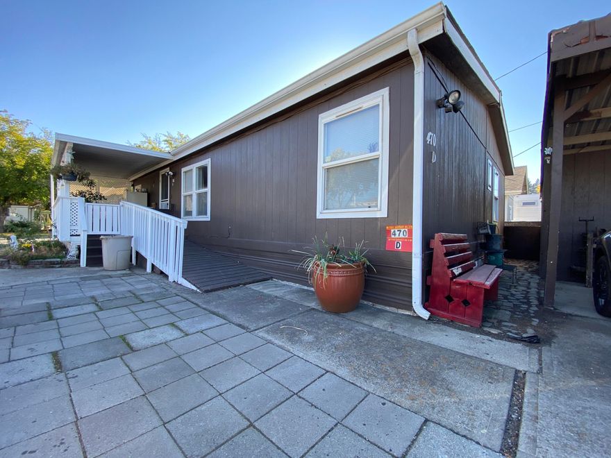Beautifully updated 3-bedroom, 2-bathroom mobile. Handicap accessible ramp, laminate flooring, backyard gates and upgraded master shower make this a steal of a deal. All steps and decking have been recently replaced as well as the roof and heat pump in December-2019. One of the nicest units in the park, this one won't last long.