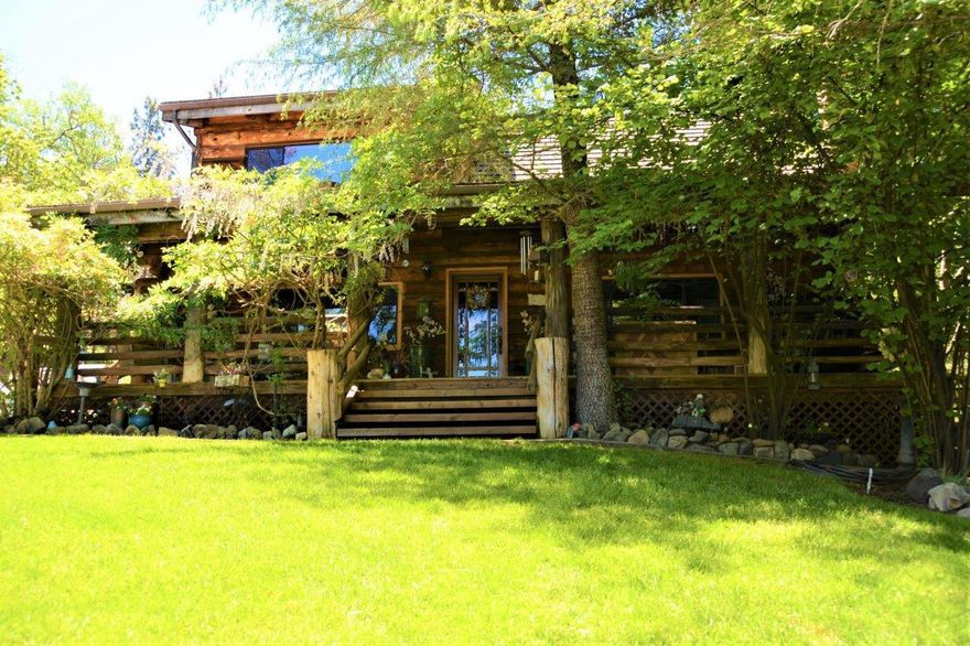 Located in Jacksonville is this rare & private 4.16 acre property. The attention to details throughout the property is similar to a Beautiful Homes Magazine. This property is simply stunning!  Starting w/ a private gated entrance & a 1200 sf Shop at the property entrance. Shop has two 12' doors & extra covered storage on both sides. The Log Cabin Home is 2,192 designed for entertaining family & friends. Large Decks in both the front & back of the home. Backyard is well designed and professionally landscaped with a deep adult pool, stream from the pool, a large covered Cabana, separate seating areas. A brand new deck with a large hot tub near the custom built Dove Atrium. Near the deck area is a fenced small pasture area & Shed for goats or small animals. The oversized 2 car garage, which is separate from the main home. has a 912sf ADU on the top floor, which is currently being rented through Airbnb for additional income, or perfect for in-laws private residence. Plenty of parking.