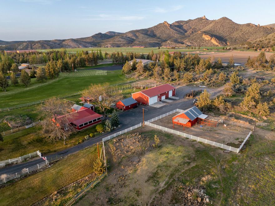 This amazing opportunity is waiting for you! Come explore this incredible piece of history and make it yours. With 5 acres of irrigated pasture and farmland, and an additional 10 acres of wooded area complete with a private lake and boat dock, the possibilities are unlimited. As you enter the private, gated paradise, you will see the charming farmhouse constructed in an era gone by on the north side, along with a fruit cellar, huge garden, chicken coup, bunkhouse, orchard, and lush green pastures. In addition, the newer shop is huge with 3 RV bays, a regular 2-car bay, a walk-in lube bay, and tons of room, not to mention the heated flooring. This is every mechanic's dream shop. To the south, you will see a horse barn, 4 acres of lush, irrigated pasture, and dynamic views of the Cascade Mountains. Eastward, a road leads to a fantastic building site, should you choose to replace the existing home, along with a private lake fed by an unrestricted 4'' irrigation feed from the COID canal.