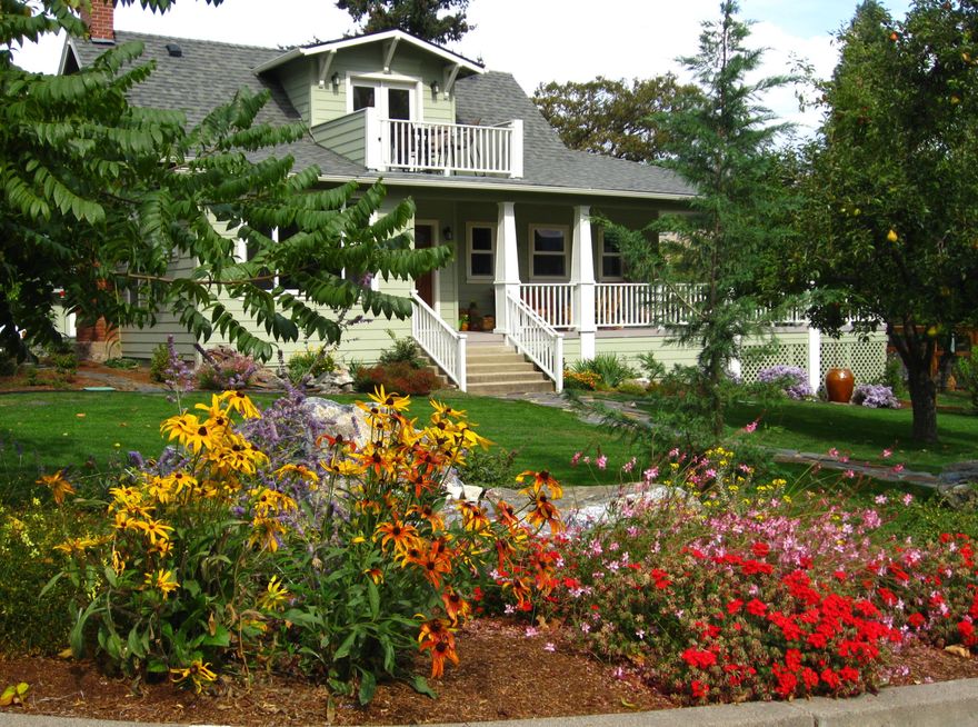 Winner of the 2012 Historic Preservation Award, this beautifully renovated 2,300 sq ft. home comes with a 720 sq ft guesthouse for a total square footage of 3,020. This home is situated in a well-established Ashland neighborhood, conveniently walkable to downtown. Modern open floor plan. Main-level living boasts a gourmet kitchen, primary suite with tiled bath, 2 additional bedrooms, second full bath, plus a half-bath for guests. Expansive decks offer mountain views. Beautifully landscaped grounds with perennial gardens, fruit trees & flowering shrubs are served by a zoned irrigation system. Hardwood floors, walnut cabinetry + built-ins add warmth throughout the well-appointed living space. Upstairs is perfect for office or 4th bedroom with half-bath and private balcony. New HVAC, electrical, and plumbing systems installed during 2011 renovation. Detached guesthouse, built in 2016, is currently a 5-star VRBO rental, or use for guests, Mother-In-Law or office/studio.