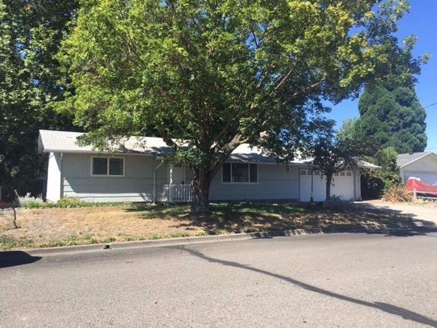 Sweet cottage in Central Point! Cute, clean and turn-key! 2 beds, 1 full bathroom. 2-car attached garage. Huge .22 acre lot with mature landscaping, decks, patio, gazebo and park-like backyard. All appliances included. New interior paint. Will go fast!