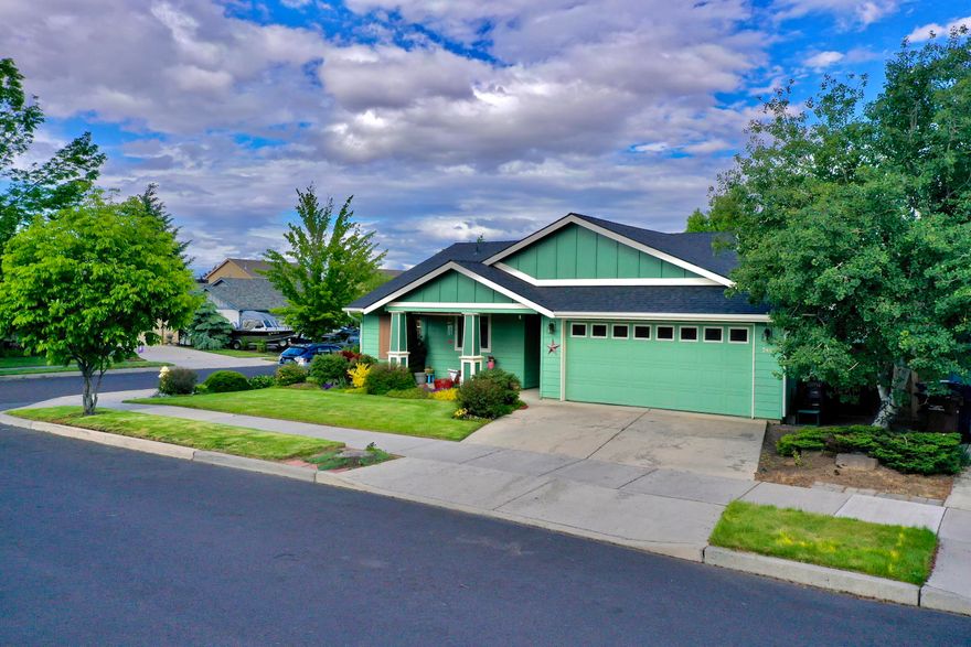 Single level Corner lot Craftsman home with 3 bed / 2 baths 1540 s.f. with a double attached garage! This home has all the bells and whistles with an open floor plan, vaulted ceilings, primary separation of the bedrooms, arched doorways, warm wood flooring, Air conditioning with forced air heat and a gas fireplace with blower in the great room. The large back deck is partially covered and faces east for nice relaxing evenings or BBQ's! Raised garden beds for home grown goodness! Beautiful home with lots of updates not mentioned. Must see!