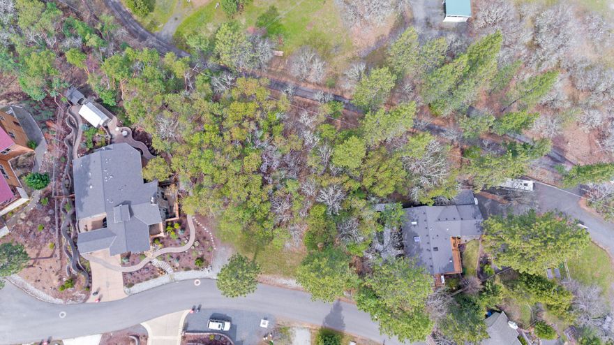 Rare opportunity to own a .45-acre lot with city services in the highly desirable Granite Ridge subdivision. Tucked away in a quiet and private setting with only nine lots, Granite Ridge is just minutes from downtown historic Jacksonville and all the charm it has to offer. Enjoy world-renowned concerts at Britt, explore local shops, dine at exceptional restaurants, and visit nearby wineries, all just moments away. The neighborhood borders the Jacksonville Woodlands Trails, featuring over 13 miles of scenic hiking. With stunning views of the valley, mountains, and city lights, and surrounded by high-end new construction, this lot is ready for your Southern Oregon dream home.