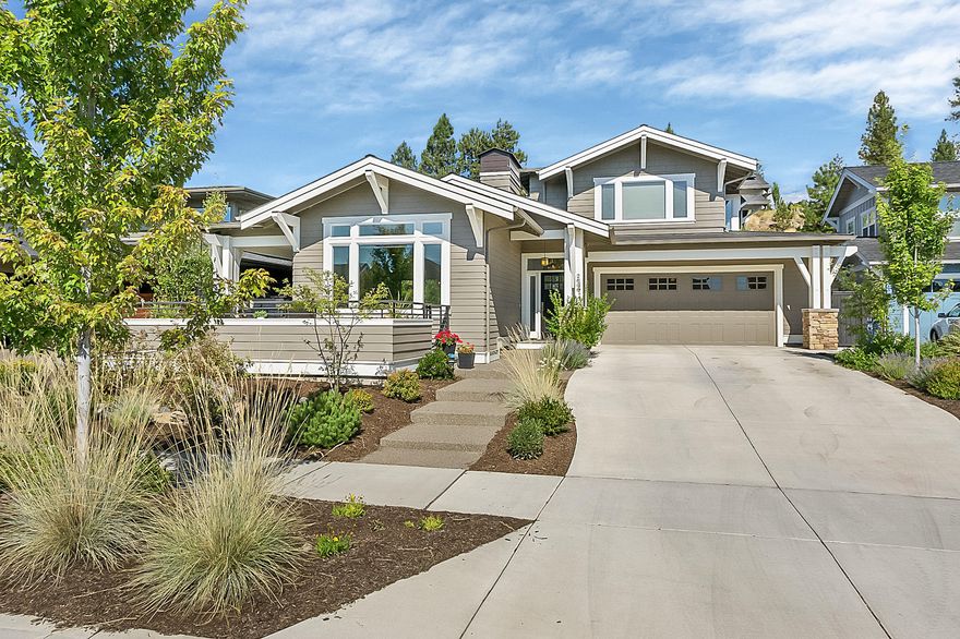 This impressive Northwest Craftsman style home combines high-end finishes with timeless beauty. Tall ceilings, abundant light and expansive living spaces make this a truly unique home in one of Bend's most sought-after communities. Beautiful hardwood floors run throughout the main floor, cozy fireplace winged by built in book shelves in living room, stunning kitchen with Thermador appliances, stainless steel farm sink and slab granite counters. Private master suit on the main level plus den/office with french doors. Upstairs you will find a rec room, built-in desk area, guest bathroom and 2 additional bedrooms. Over-sized garage w/ bonus shop space, and a large fully landscaped and fenced backyard. Home has a 6KW solar power system that makes the power bills next to nothing. The thoughtful design of the home, along with its multiple outdoor spaces makes it very easy living.