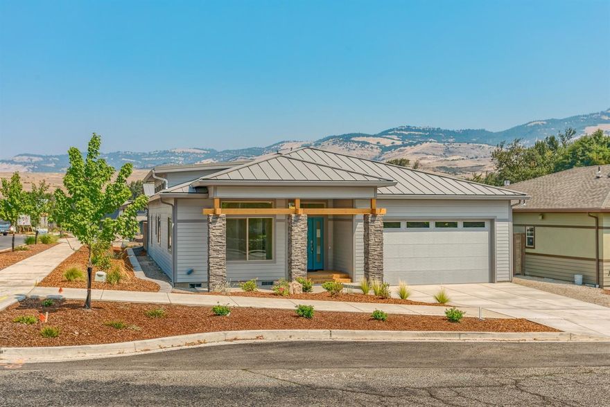 Huge price reduction, now only $499,900 for 1695 SQFT of luxurious, green built new construction in Ashlands' newest subdivision. The stunning 3 bedroom, 2 bathroom home has so many features it's hard to list them all. Lets start with the spacious hallway leading into the open kitchen and living room area with tall 12 ft ceilings. Engineered hardwood floors, custom cabinetry throughout. Quartz countertops in the kitchen and both bathrooms, Beautiful tile and stone surround shower and bathtubs. Heated floors and mirrors in Master bathroom. As for energy efficiencies, High efficiency heating, cooling and water heater, Insulation in floors, walls and attic that far exceeds code. There is even an electric car charging station in the garage! Stainless steel kitchen aid appliances, including refrigerator. Close to Schools, the Bear Creek greenway, downtown Ashland with it's award winning Shakespeare festival and the ultimate in Pacific NW lifestyle You really need to see this home.