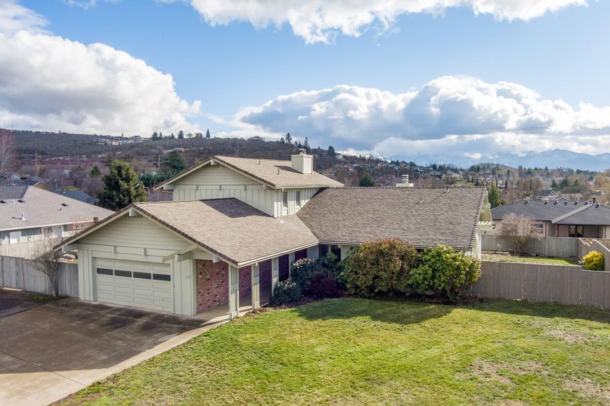 This is a wonderful home with so much to offer!  Located  in a quiet neighborhood, this 2,650 sq ft, house is situated on a large lot, with great views.  It has 3 bedrooms and 2-1/2 bathrooms, plus an office (or possible 4th bedroom).  Additionally, this home has a large basement, complete with cold storage.  In the kitchen, there is a breakfast bar and plenty of cabinets for storage.  On the main level, you will also find the laundry room with sink.  Upstairs is a huge master suite, complete with walk-in closet, dual sinks, tub and separate shower.  If you need room for your RV and toys, it has that too!  In the backyard, there is a raised garden and great composite deck for enjoying those warm summer evenings outside.  With some updates, this home will really shine!  Don't miss it!!