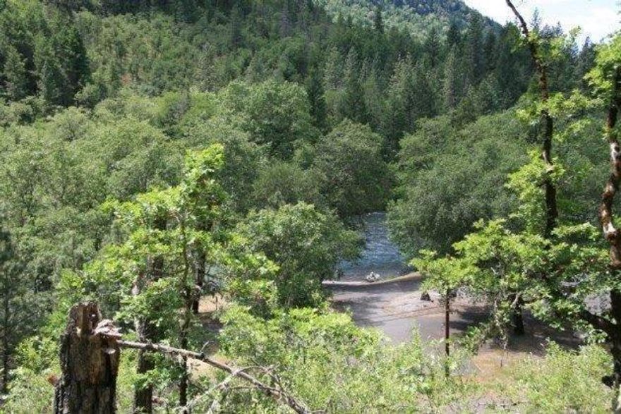 Great 5-acre building site in the trees across from Rogue Elk Park and the Rogue River. Well with pump. Power and telephone available. Approximately 300 feet to the Rogue River and boat ramp. 7.5 miles to Lost Creek Lake Marina at Stewart State Park. 5 miles to Shady Cove. 16 miles to Eagle Point and Wal-Mart Super store. Come experience this special property with views of the Rogue River.