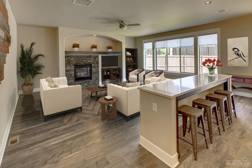 For good reason the McKenna floor plan is by far one of Pahlisch Homes most sought after and located in beautiful Stonegate, this home is a win win. Situated on an interior lot that backs to paved trails this home, built in 2016 has many bells and whistles that newer construction homes can lack. For one, space with a great room & den on the main level and 4 bedrooms & bonus room upstairs there is loads of space for family and guests. And then there are the finer details; quartz counters and knotty alder cabinets, SS appliances, engineered hardwood floors, full tile backsplashes in the kitchen and tile back splash in all the bathrooms with tile floors and a few barn wood accent walls to name a few. Almost every window and sliding glass door has Hunter Douglas blinds, some even automated. Enjoy a covered back patio with outdoor speakers and access to the trails just out the back gate. Last but not least, a 2.5 car garage for added room to store all you need to enjoy the outdoors.