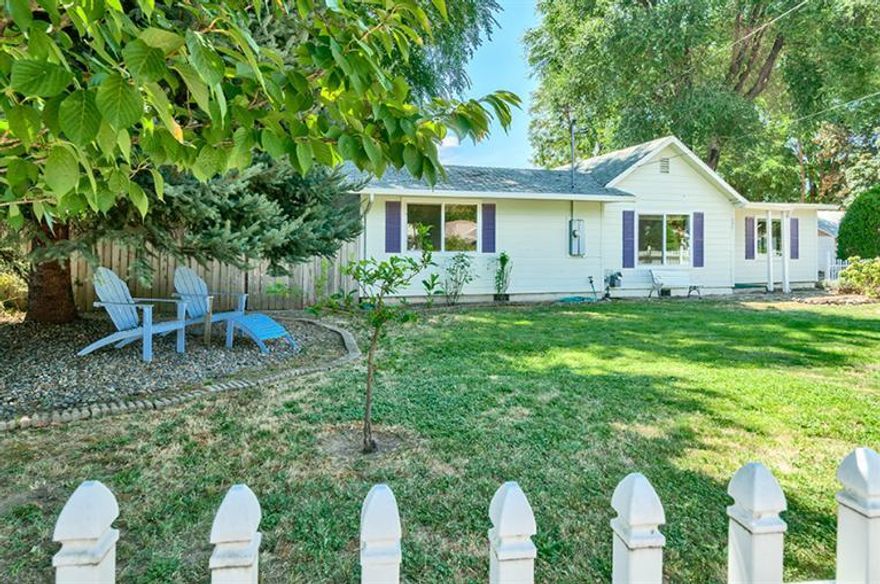 Charming cottage with an amazing back yard. Located close to the friendly little town of Rogue River. Kitchen has granite counters, gas range, hardwood floors and a garden window overlooking your own little piece of paradise. Split floor plan, master bedroom open to back yard, huge custom walk-in closet, brand new carpet and new paint. Living room has hardwood floors and a view of the mountains. Behind the fence are vegetable and herb gardens. Back yard is perfect for entertaining, large deck and a serene landscaped flagstone yard. Home is sided with hardy plank. This home is a must tour to appreciate!