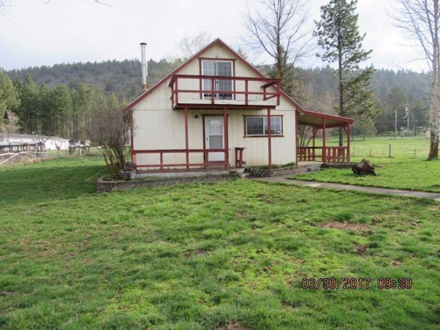 You don't want to miss out on this one! Walk to the country from this 4 bedroom 2 bath located just minutes from the hustle and bustle of the city! You'll love the welcome home front porch, laminate flooring, gleaming woodwork, sun-filled rooms and garage/workshop. It is a friendly home at a friendly price!