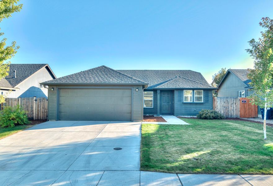 This traditional single level Hayden home is situated in the desirable and quiet Village Pointe neighborhood. This 2015 home features 3 total bedrooms and 2 bathrooms with an office space off of the main entryway. The main living area offers vaulted ceilings bringing an abundance of natural light. Complete with a private, fully enclosed and freshly landscaped backyard with plenty of space for outdoor seating and pets. The front driveway features enough space for additional parking. This immaculate home is conveniently located near Redmond High School and public parks.