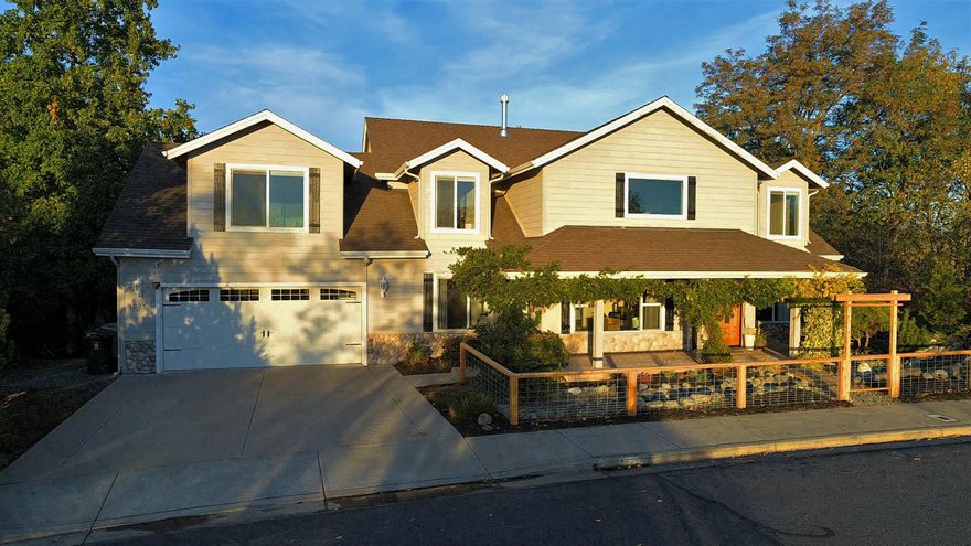 This 4 Bedroom, 3 Bath 3,342 square foot home is located at the top of the world on Starlite Pl. The spacious entrance invites you to an open concept kitchen, dining, family and bonus room. Three decks accessed by two sliders and a pass through window connect you to indoor/outdoor balcony entertaining. Designer details include cedar fencing and a custom arbor, hardwood floors throughout the main floor, artistic details, granite kitchen countertops and plenty of storage. While listed as 3 bedrooms the 2nd floor offers a huge 400 square foot bonus space with plumbing! ADU, homeschool space, 2 additional bedrooms, music room. The Master suite in located on the main floor! The best of both worlds spectacular views and adjacent to the up and coming Dollar Mountain trail system. 444 acres of  hiking, biking and wildlife are just steps from your doorstep. Unimpeded views of 444 acres of BLM and expansive city views of Grants Pass out back. Welcome Home!