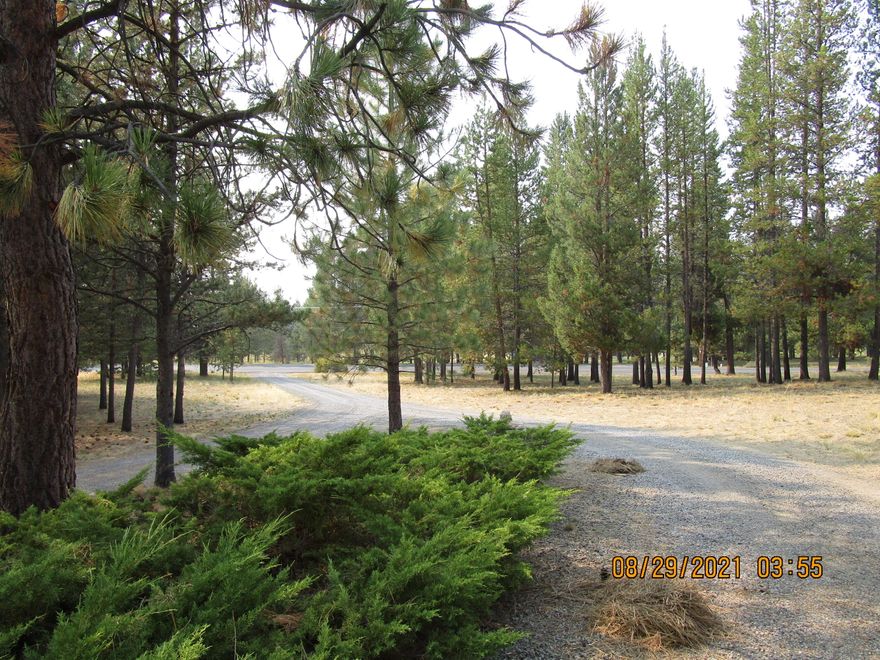 Lovely 1.25 Acres located in Lazy River South.    Beautiful Land, Well maintained with Lots of Trees. Great Privacy. Across the road from the Little Deschutes River. No well or septic on property.