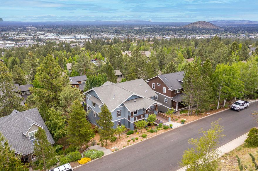 $145k price reduction!! Breathtaking panoramic Easterly views from the moment you step inside this tastefully updated home in Awbrey Village. Grand ceilings and windows capture Smith Rock and the city. Step out on the oversized decks, entertain friends with views of the 4th of July firework show from Pilot Butte, neighborhood block party! Main level living with master, office, kitchen, dining, 2nd bedroom and guest bathroom. Lower level featuring huge bonus room/flex space with wet bar, laundry, guest bathroom, 2 additional bedrooms. This level also features a separate entrance and deck if separate living quarters are desired.  Ample storage throughout! Gym room in the three-car garage. Completely fenced with electric gate to enclose the private backyard with raised irrigated garden beds. Close to everything Bend has to offer including river trails, parks, downtown, and shopping with easy access to Mt. Bachelor and the Cascade Lakes. Instant equity at this price!