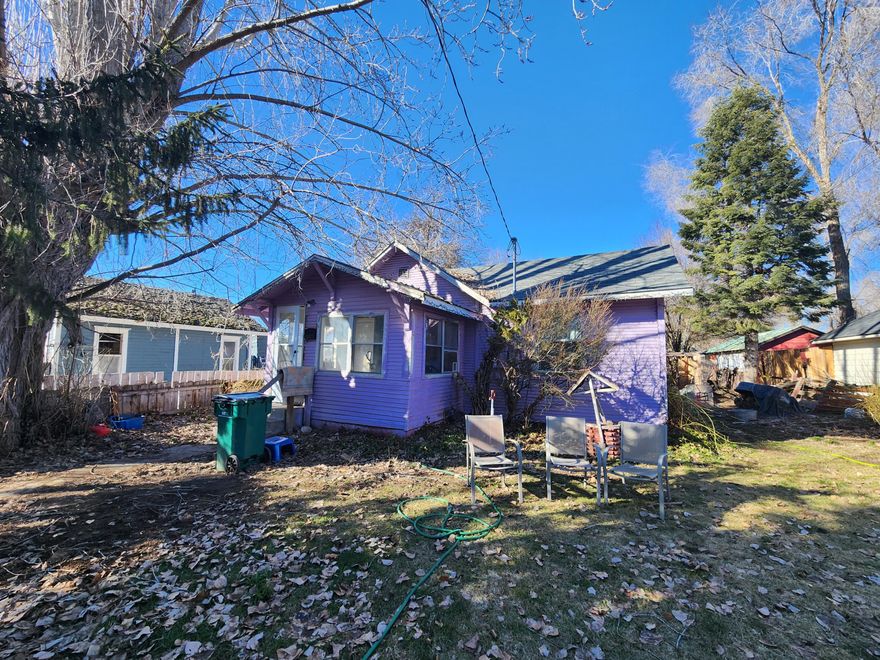 Cute 1 bedroom fixer upper close to shopping and dining. Home features 1 bedroom, a split bathroom, large laundry room, large yard, mature trees, newer roof, newer windows, and gas furnace that has recently been serviced. Home needs some work but has a ton of potential!