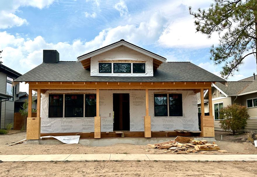 Discover the perfect blend of craftsman charm and modern convenience in this brand-new single-level home in Discovery West. Built by Abbot Butte Contracting LLC, this 3-bedroom, 2.5-bath, 1801 sq ft home offers a thoughtful floor plan with high-end designer finishes throughout. The inviting open-concept kitchen features Silestone countertops, a stylish tile backsplash, and seamless flow into the dining and living spaces, highlighted by a cozy shiplap fireplace. The primary suite includes a spa-like bath with a tile shower and elegant fixtures. Two additional bedrooms share a beautifully designed bathroom, and a separate powder room adds convenience for guests. Enjoy the outdoors year-round with a covered patio and charming front porch. Completion is set for late January 2025—move into this highly sought-after Bend community and enjoy nearby trails, parks, and amenities!