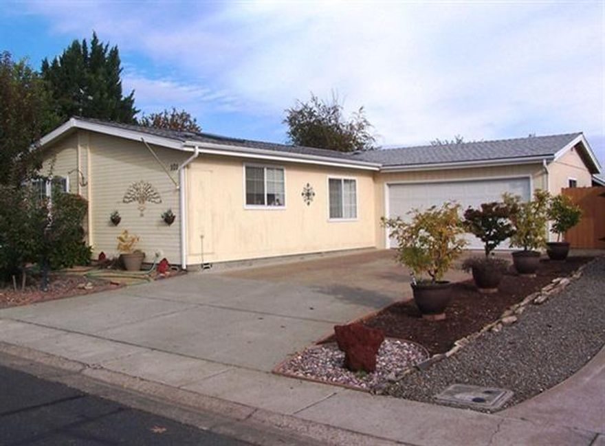 Well maintained Golden West doublewide in the best 55 & older community in Central Point - The Meadows. 2 bedroom, 2 baths 1392 square foot manufacture home with attached 2 car garage. Spacious & open floor plan with vaulted ceilings in living, dining & kitchen areas. Newer ceramic flooring in entry, kitchen & master bath. Kitchen has recently purchased appliances, which are included. Large master bedroom having vaulted ceilings with walk-in closet, & bath suite with soaking tub, shower double sink cabinets & huge skylight. New roof & skylights in 2010. New water heater 2012. Fully fenced & park like rear yard with covered patio & mature fruit trees. Part of the lifestyle of living in The Meadows are community amenities that include community a pool, hot tub, fitness area with exercise equipment, library for books & videos, and game room with pool table and shuffleboard table. RV parking area available for residents. Now's the time to start enjoying life here at the Meadows!