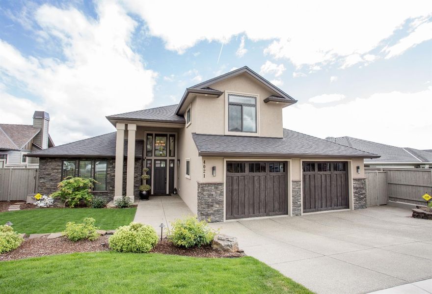 Beautiful, ultra-custom home with $150,000 in upgrades. Luxurious master suite on the main level. Open, large island kitchen with painted cabinets, Wolf gas cook top, built-in full size wine refrigerator and walk-in pantry. Extra wide plank maple hardwood floors. Family room has 13 ft. tall ceilings with a floor to ceiling tile fireplace surround and granite mantle encasing a lineal gas fireplace. Eight ft. doors throughout. Large home office with built-in cabinets and desk with granite top. Amazing outdoor living room area with a double sided fireplace and floor to chimney stone surround. Built-in BBQ, sink, refrigerator, tile counter tops and cabinets. Views of Mt. Ashland, surrounding mountains, and Rogue Valley Manor. Gorgeous in-ground pool and hot tub. Very nicely landscaped. Extra wide and deep, two car garage with built-in cabinets. Alarm system. Security cameras. Custom built storage shed on the side yard. Central Vacuum. Two furnaces and 2 AC units.