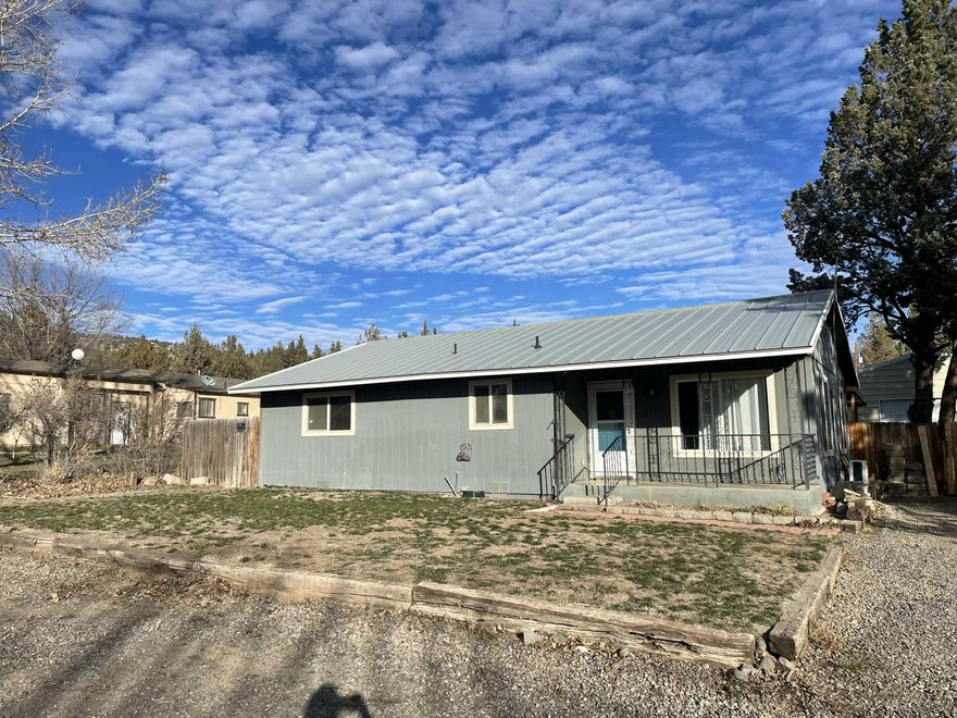 Come take a look at this wonderful home! It has 2 large bedrooms and 1 large bathroom, the open floor plan makes it great for entertaining or having family over for the holidays. The large backyard was recently landscaped and ready for sod or grass seed. Through the large drive-thru gate you will find a 500 sqft shop with a 10' rollup door and 12' eaves. The back deck that goes the length of the house was recently covered 3/4 of the way when the new roof was put on in the summer of 2020. Property is located in Ochoco West that includes a fishing lake, ATV/horseback riding trails, a pool in the summer, stables for your horses, RV parking and a clubhouse to use for any gatherings you may have. This won't last long.