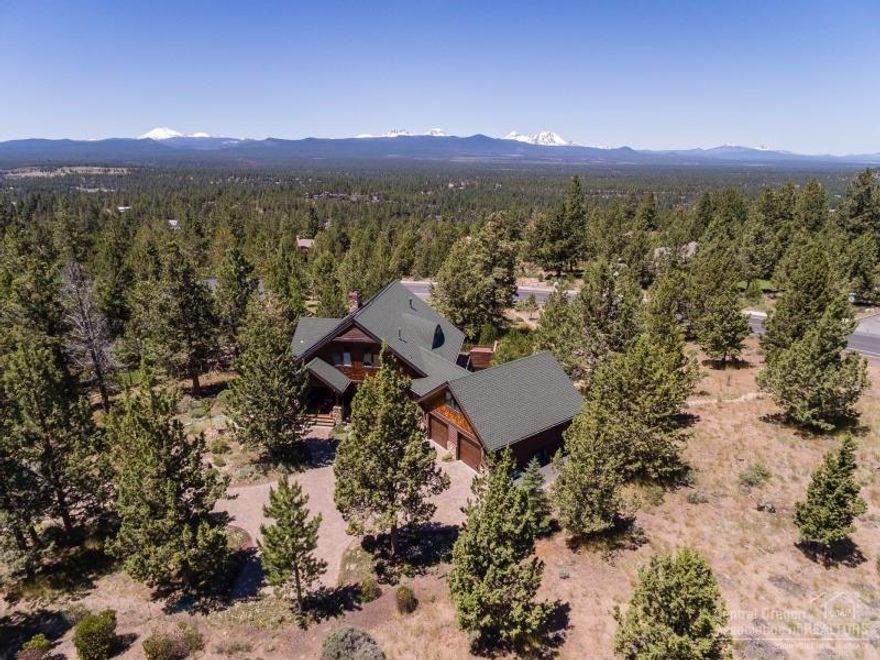 Nestled in the pines, on just over an acre, sits this quality, custom built home on Awbrey Butte w/stunning Cascade Mountain Views! Meticulously maintained, featuring an open greatroom w/hickory floors, spacious kitchen, built-in shelving & cabinetry throughout, office w/murphy bed, solar energy, AC, tons of storage, 859 sq ft garage, front covered porch, large back deck w/hot tub, upstairs master suite w/tongue & groove ceiling, fireplace, walk-in shower, & separate sitting area. This is a must see!