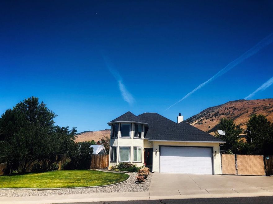 Calling all gardeners! Come see this fantastic North Hills contemporary with an excellent backyard on a corner lot. This home has a large greenhouse with two sheds and RV parking. There are bountiful fruit trees including; apple, peach and nectarine. A formal living and dining room greet you upon entering the home. The open-concept kitchen overlooks the cozy breakfast nook and living room with a wood burning stove for those cooler nights. Just off the living room you can access the backyard with a generous patio space and paths to the garden. The three bedrooms with two full baths complete the upper level. Central air conditioning, stainless steel appliances, and so much more! It's hard to list all the indoor and outdoor features of 1,947 square foot home. Situated in a family friendly neighborhood near a great park and hiking trails. Schedule your showing today!