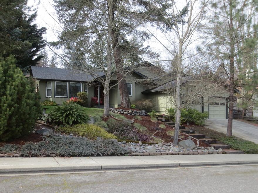 Wow! incredible home located in a really nice established NW neighborhood. Mature and park-like setting surrounds this home. Features 3 bedrooms, 2 baths, approx 1815 sf., living room has vaulted ceilings and 3 sided gas fireplace, new energy efficient Heat Pump, tile counters and newer tile floors in kitchen, large master bedroom with sitting area and tiled master shower is spacious, 3rd bedroom is used as a den with double entry doors, nook, newer roof and paint, deck, very cool custom gazebo, shed, and all landscape planters and decorative items included in sale.