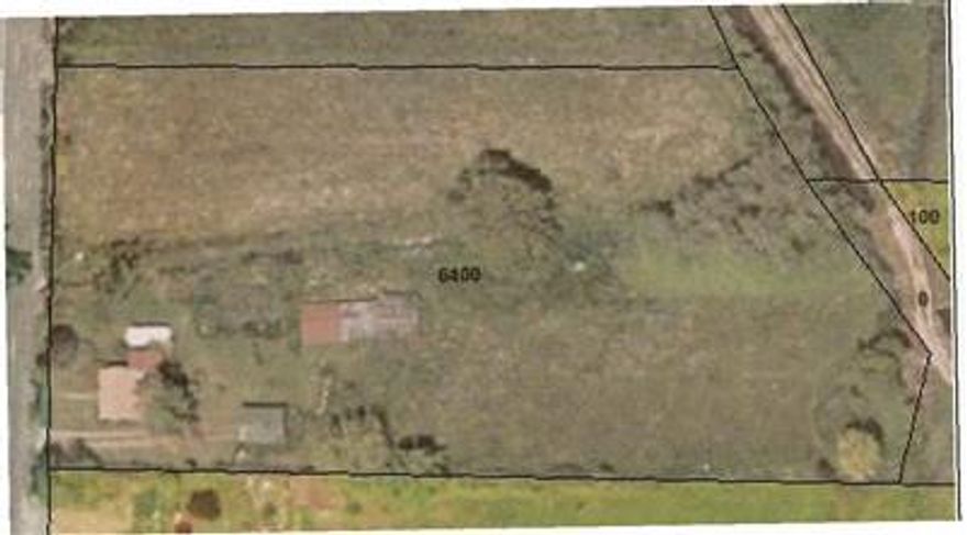 Location, Location, Location!!!! Finally elbow room and yet still close to town. City Sewer and other city amenities but on a quiet country road. MID irrigation rights, and the chance to gain water rights with RRID which the canal runs along the east side of the property. Beautiful mature trees, open fields, partially fenced. Existing home is in very bad condition and the selling family does not think there is a foundation. The other out buildings are also in bad repair and are of no value. The land, views & country living is all your buying here.