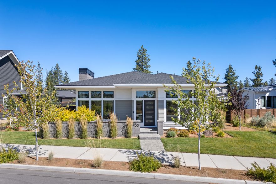 Presenting an exceptional single level Salvesen Homes built home in sought after Discovery West in NW Bend. Situated on a premier lot, this prairie-style residence showcases top-tier craftsmanship and high-end finishes throughout. The chef's kitchen features two dish washers, solid surface countertops, high-end stainless appliances, and an oversized island. The great room boasts 10' ceilings, abundant natural light from large windows, and beautiful wood floors. A built-in Sonos system provides audio throughout the home. The primary suite offers an exquisite tile shower and a spacious walk-in closet, complete with heated floors. A designated, versatile office ensures a private workspace. The meticulously landscaped yard includes a covered patio and a tranquil water feature, perfect for year-round entertaining. The oversized 3-car garage offers ample storage for all your storage and Bend gear essentials.