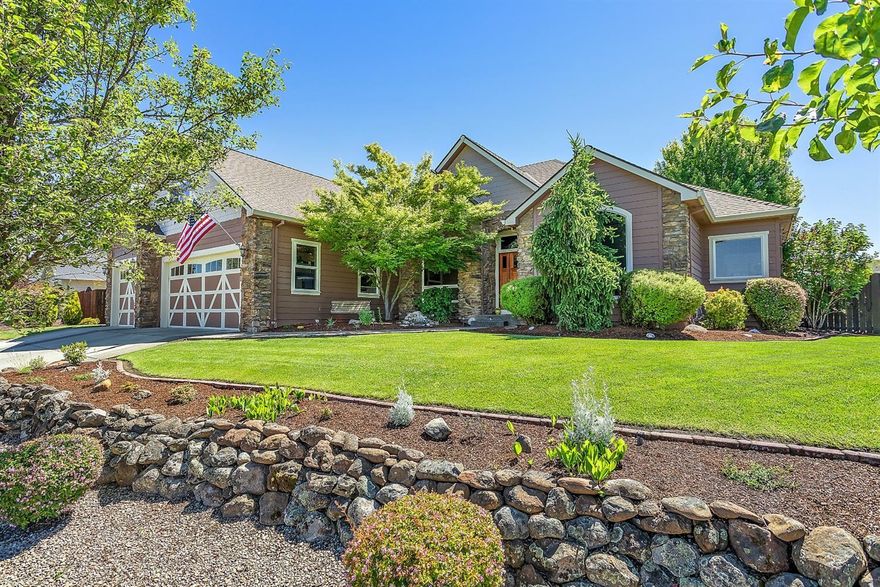 You will love where you live after choosing this beautiful Eagle Point Golf Course Community home! Open concept & split bedroom floor plan features marble entry floor, great room, vaulted den/office, & spacious formal dining room. Cherry hardwood flooring, arched doorways & crown molding throughout. Bose surround sound system & gas fireplace in great room. Kitchen offers granite counters, travertine tile backsplash, raised eating bar, gas range/oven, dishwasher and microwave. Bay window in dining nook. Main level master suite has double-door entry, mansard ceiling, double closets, double sink vanity & beautiful walk-in shower - the master bathroom is gorgeous! Two guest bedrooms & office on main level. Vaulted upper level bonus room/bedroom with full bathroom. Indoor laundry room with sink, folding counter, drying rod & extra cabinet storage. Mature landscaping with gardening beds, water feature, retractable patio awning, dog run & garden shed. Attached 3-car garage.