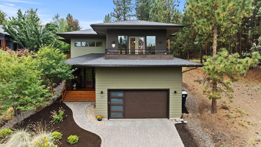 Welcome to The Treetop Oasis—a contemporary custom home in one of NW Bend's most coveted neighborhoods. This reverse-living home on a large lot captures sweeping treetop views from its elevated deck, the perfect backdrop for sipping your morning coffee. Inside, acacia hardwoods and a floor-to-ceiling fireplace with built-ins create a cozy gathering space, while updated fixtures + hardware pair w/ custom cellular shades for effortless style + privacy. The flat backyard boasts a greenhouse, firepit, and low-maintenance turf—ideal for gardening, entertaining + cornhole tournaments. A heated driveway eliminates winter shoveling and lofted garage storage keeps your gear organized. All tucked in a quiet, tight-knit neighborhood (turnover is so rare!) with an easy stroll to Quail Park and 6 minute drive to NWX's restaurants + shops. From afternoons at the pickleball court to accidental dinner parties on the patio, The Treetop Oasis is the place you'll always be happy to come home to.