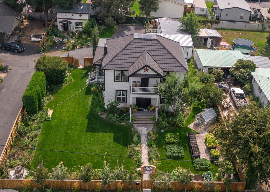 Originally built in 1906 but you would never know it with all its renovations & updates. This amazing property was one of the original homesteads in Prineville has completely renovated/updated with new plumbing, electrical, insulation, flooring, lighting, main level kitchen & laundry & bathrooms, heating, water heaters, lighting, windows and so much more – the full list is incredible & available. This property has so many options for the investor, or entrepreneur (it was a 5 Star Bed & Breakfast) or someone who wants a beautiful home with maybe a couple rentals. 2600+SF home has 5 bedrooms, 3.5 baths, a cottage and 4 car garages! Also there is plenty of off street parking, manicured landscaping & privacy too! Fully fenced, and a greenhouse-to-garden area, fruit trees, raised garden beds all on a .36acre lot!