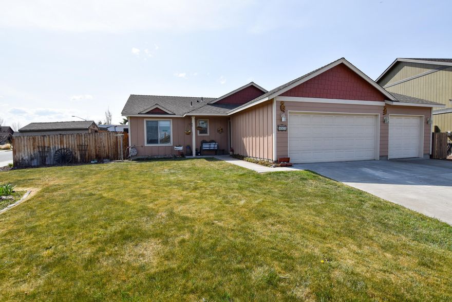 Located on a large corner lot in Julina Park, this single home has been tastefully updated and has room to park your boat and RV! As you enter, the kitchen is open and bright and features a pantry and eating area. The living room has beautiful, engineered wood flooring throughout, a gas fireplace and vaulted ceilings. Down there all you will find the laundry closet, full guest bath and 2 guest bedrooms. The primary bedroom includes a walk-in closet and private bath with custom barn door and tile flooring. The backyard is fully fenced with sprinklers. There is plenty of room to garden with fruit trees and room to relax on the paver patio around the firepit! Additional features include a 3-car garage, natural gas forced air, AC, storage shed and room to park your toys!