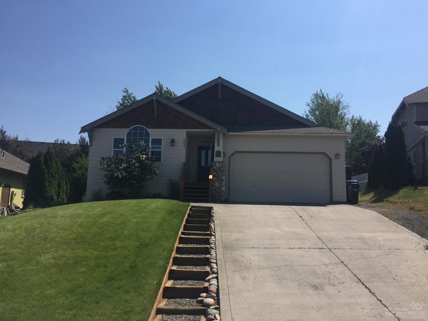 Beautifully remodeled home w/lovely landscaping & Smith Rock views in nice SW neighborhood. Features include; new granite slab counters, glass acrylic tile back splash, vinyl plank wood floors in bathrooms/utility room, tile floor in living area, stainless sink & faucet, newer interior/exterior paint, vaulted ceilings, large rear patio w/pergola, water feature, & RV Parking. Desirable floor plan that would make a great family home w/separate office, family, & living rooms w/large park less than a block away