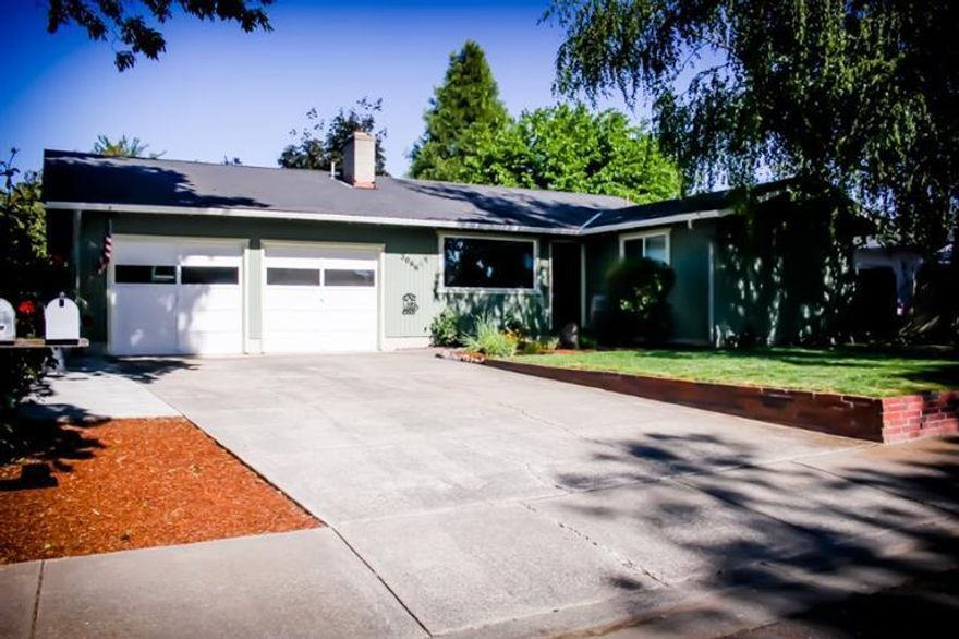 Come see this clean move in ready 3 bedroom 2 full bath home! Living room features large window, attractive archways and a cozy fireplace. Fireplace has custom mantle and framing to relax by on cold winter days. Kitchen has been completely redone with new hickory cabinets, countertops and sink. Other upgrades include new windows, flooring, exterior paint, and much more. Private fully fenced and landscaped back yard with patio and Hot Tub.