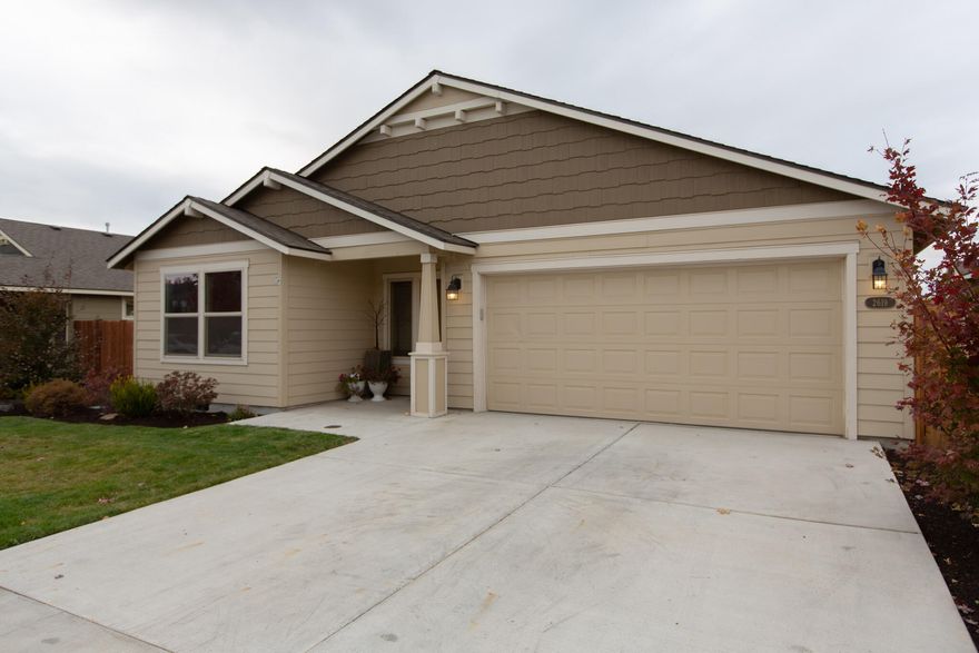 Everything you could want in a home! Located in Redmond's Premiere 27 Elm Community this 3 bedroom, 2 bath, 1866 sqft home is definitely one you don't want to miss! Enjoy upgrades from electric blinds, prewiring for a theater system, can lights, and tons of natural light. Open concept living area with gas fireplace and vaulted ceilings. This house features an amazing kitchen with granite countertops, an island with a gas stovetop, wall oven, new microwave, lit overhead glass hood, corner pantry, and stainless steel appliances. The primary suite is equipped with coffered ceilings, a ceiling fan, a soaking tub, a tiled shower, double vanity, and a walk-in closet. New low-maintenance landscaping in the back has a new drip system installed for water efficiency. The back is fully fenced and partially covered with lots of room to entertain. This home is ready for its next owner.