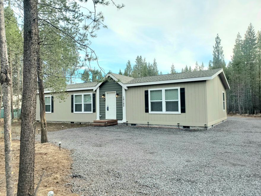 New Price PLUS seller to contribute $10,000 towards buyers closing costs, pre paid items and or rate buy down!
On a paved Road! 
Newer 2024 Home, ATT Septic System and Well!  Set back from the road, fully fenced and nestled in the trees with room to build a shop/garage.  This gorgeous home features an open floor plan with huge kitchen island and tall ceilings.  Primary ensuite is spacious and bath has double vanity sinks plus additional vanity area.  All bedrooms have walk-in closets too.
There are extensive gravel parking areas for vehicles and RVs plus a
new 20x30 Metal Carport to park out of the weather!