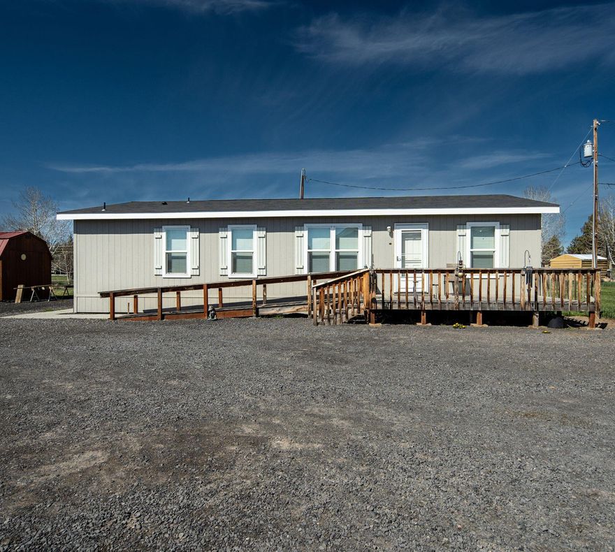 SELLER to CONTRIBUTE up to $10,000 towards MOVING the dwelling!
Welcome home to this like new 2018 manufactured home. Spread out in the 18x13 living room open to a similar sized kitchen and dining room space. Home features generous cabinets, pantry,  utility room with exterior access and newer carpet. Enjoy the contemporary styling and split concept living.  A secluded primary bedroom with walk-in closet is on opposite side of home from the guest bedrooms.  Home has been meticulously maintained. Structure is considered personal property & was previously placed under a hardship permit. Home MUST be moved from current location. Contact Listing Agent for lender and mobile home moving options.