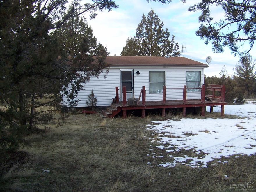 Here is a perfect opportunity to get into a property and fix it up. Almost 5 acres with a well and manufactured home. Property is in an area of nice homes and with a little work can be right up there. Call listing agent for more details and how to access the home.